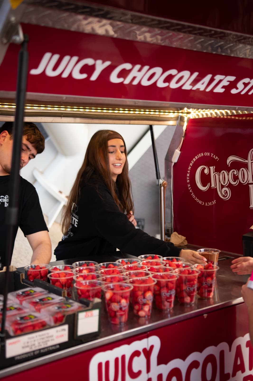 Chocolate Boys operator smiling at the service counter