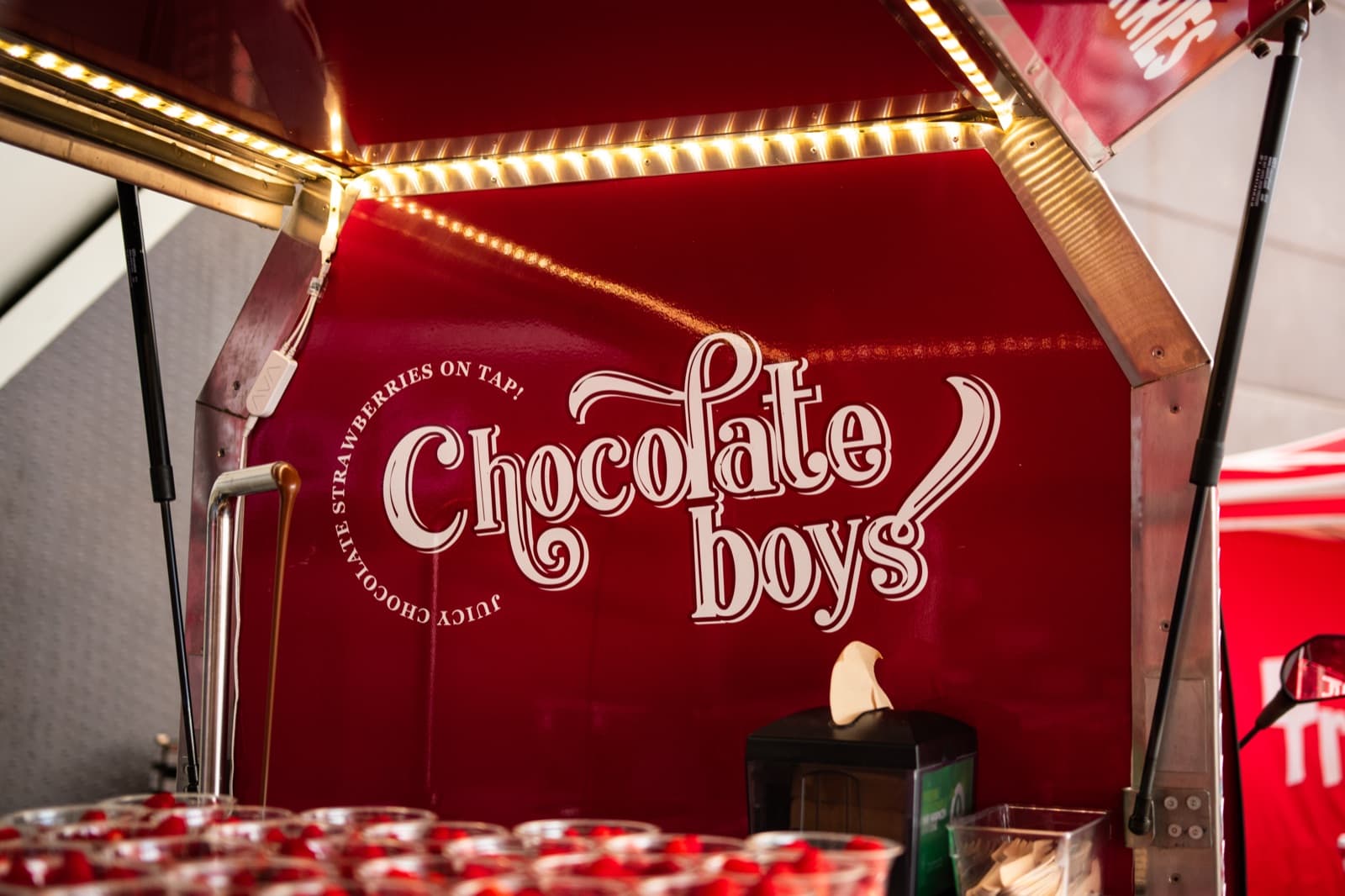 Juicy Chocolate Strawberries on Tap signage on the tuk-tuk